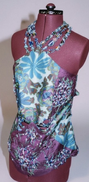 Close-up of hand-applied beadwork on purple dupion silk panelled dress