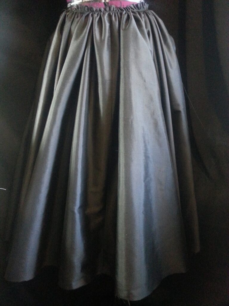 Black silk double circle skirt volume bespoke dressmaker Surrey
