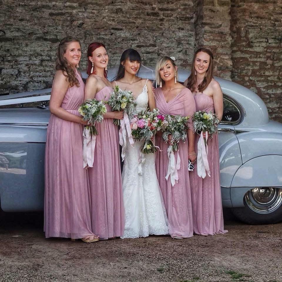 bridal alterations crystal palace lace illusion neckline detail showing so well with bridesmaids in picture