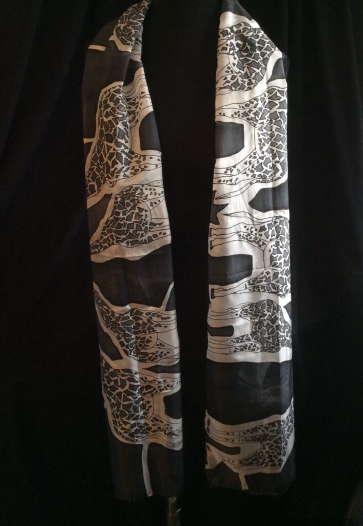 black giraffe silk scarf ivory contrast design on the mannequin 