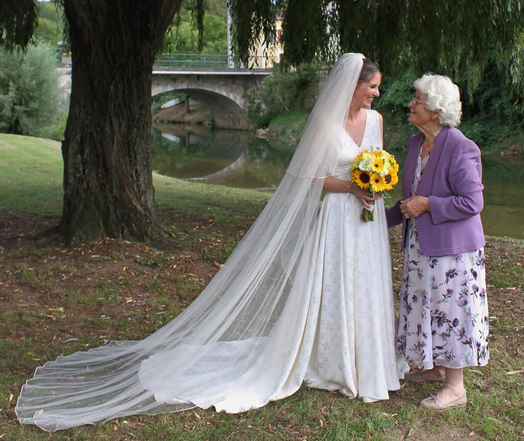 bride wearing restored grandmother wedding dress modern heirloom bridal gown