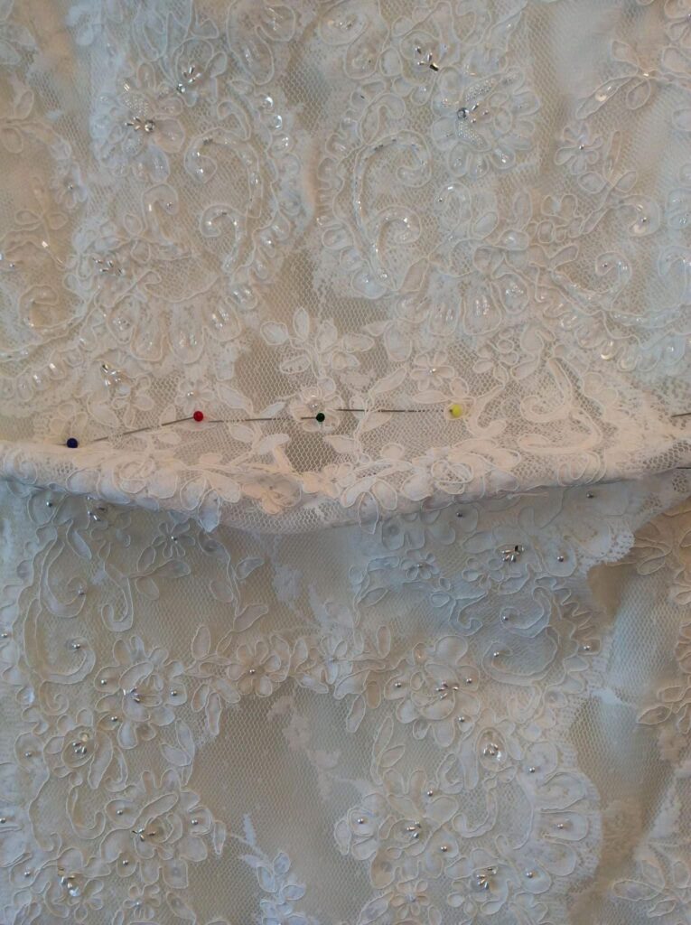 lace wedding dress crin embroidered hem detail pronovias