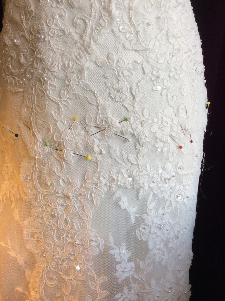 lace appliqué reapplication hand stitched bridal gown