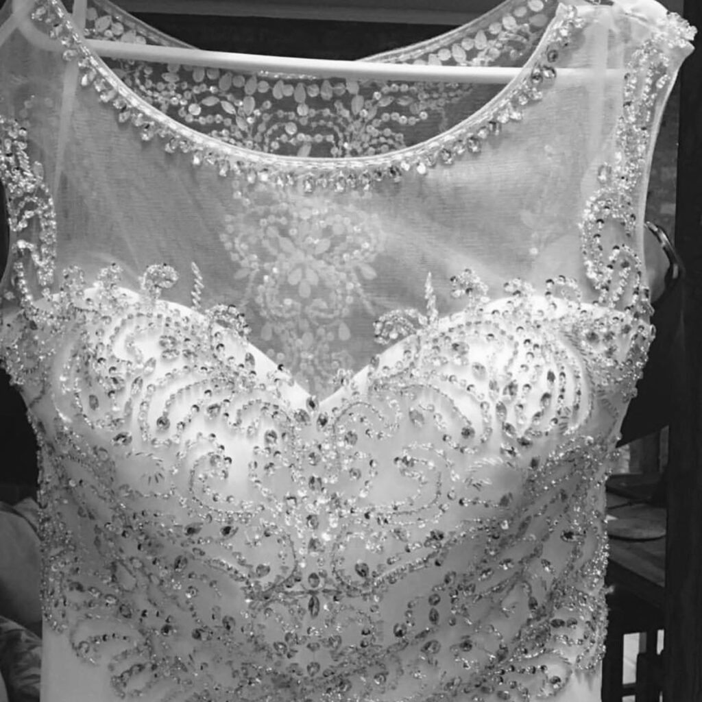 Before sleeveless boat neck wedding dress with crystal embellished bodice