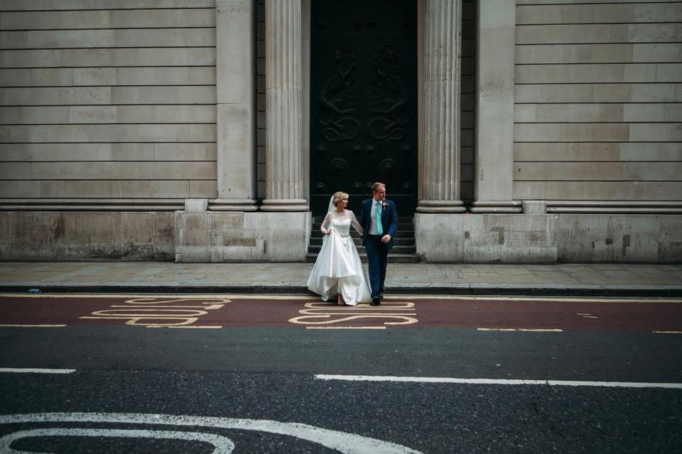 South London bride walking in wedding dress after length adjustment and full restructure
