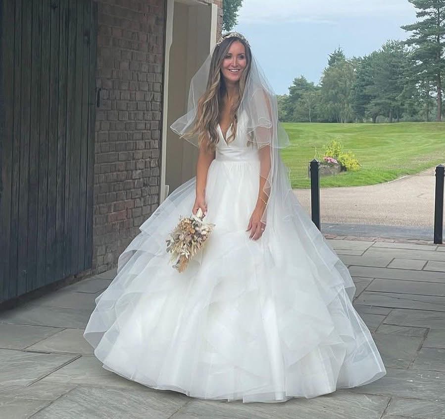 Bride l and couture wedding dress following luxury bridal alterations in Caterham 
