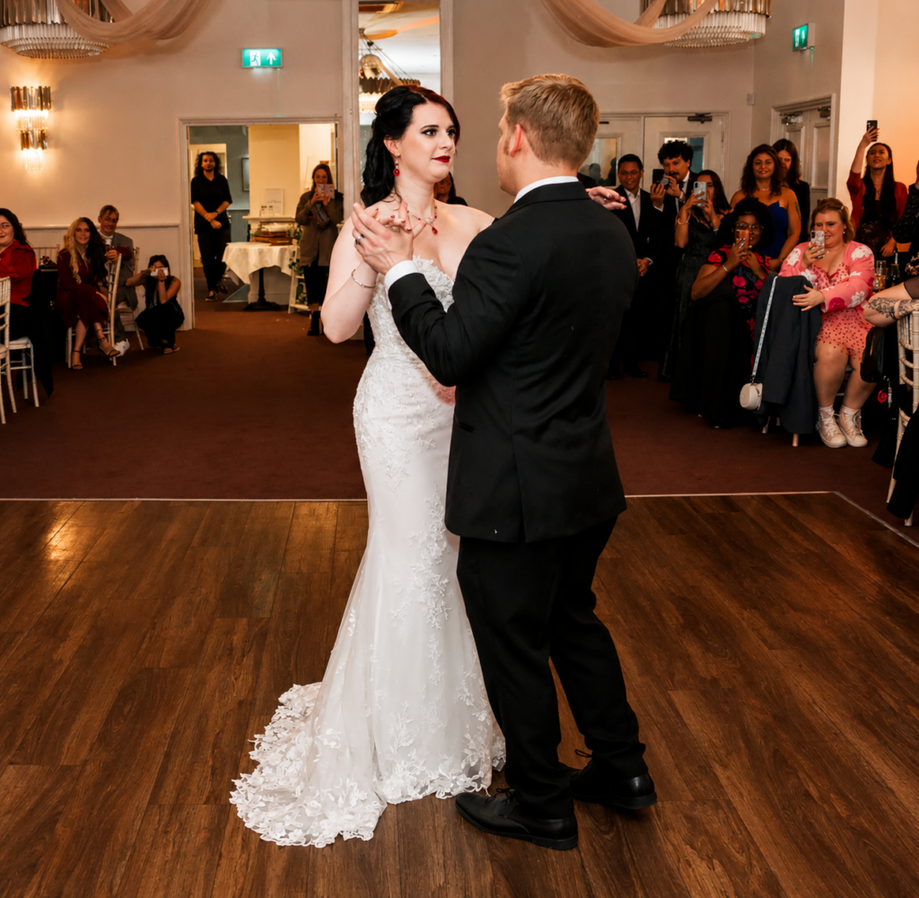 Fitted lace wedding dress alterations with contour shaping and bustle work for alternative bride