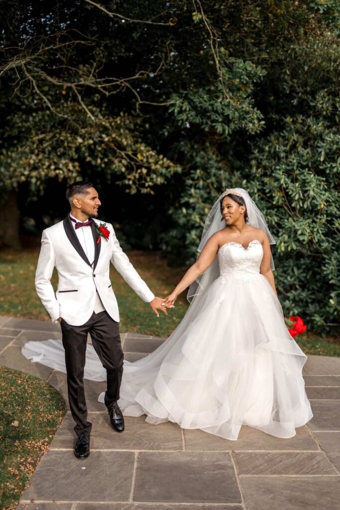 Bride wearing altered WED2B wedding dress with couture modesty panel and reconstructed neckline