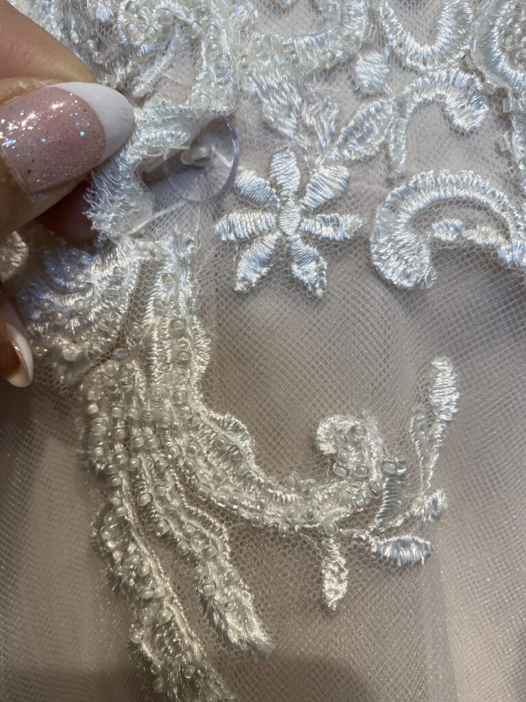 bustle button and ribbon