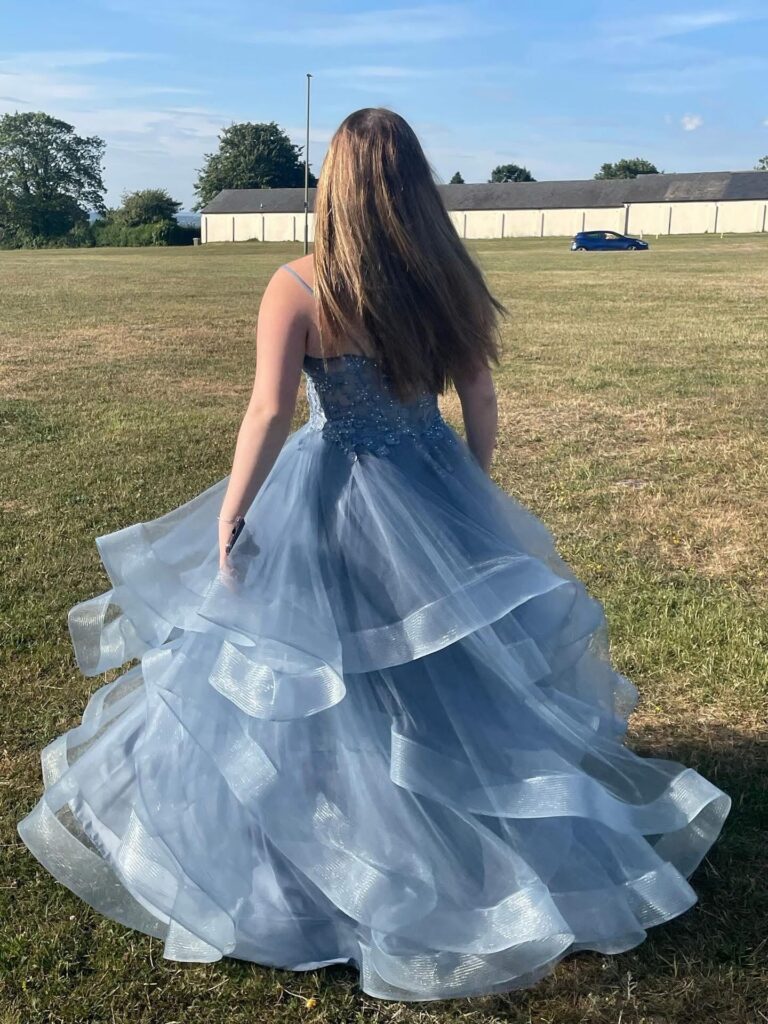 Layered steel blue gown with couture skirt reshaping and formalwear alterations back view
