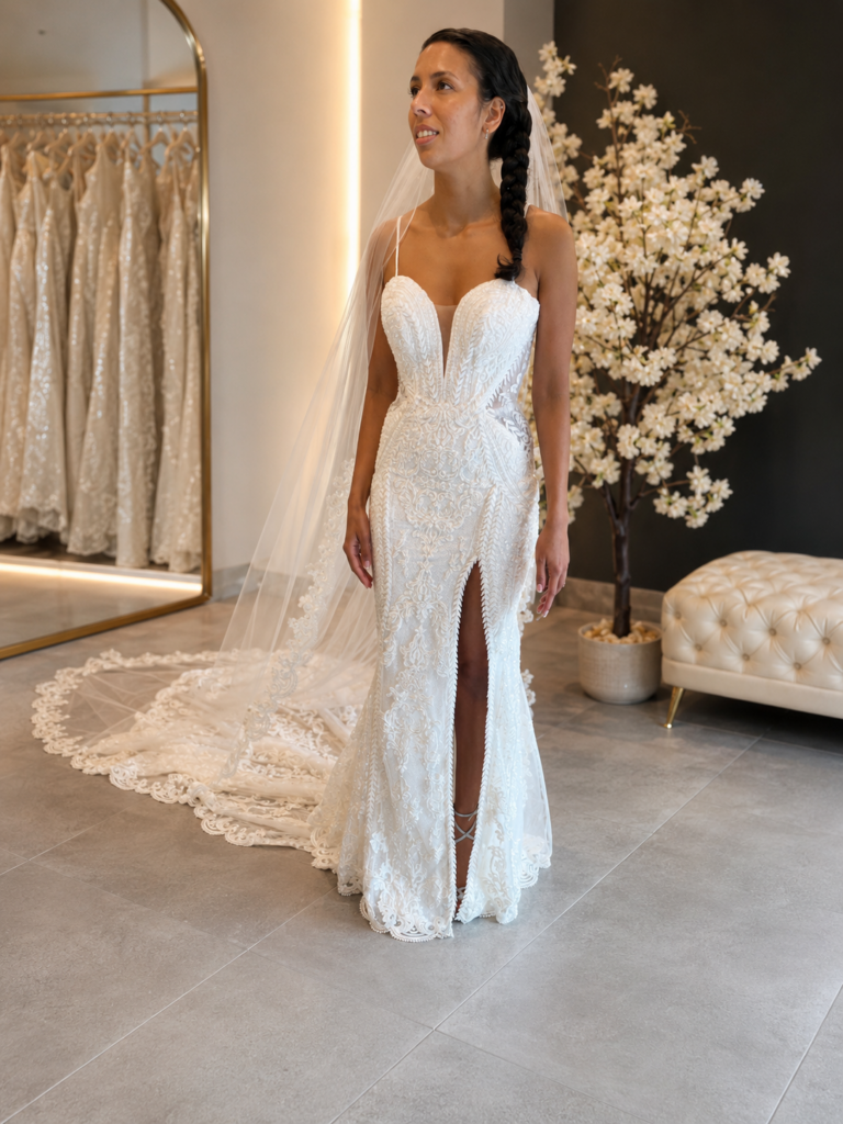 Bespoke cathedral veil designed to complement a beaded wedding dress with bespoke couture adjustments