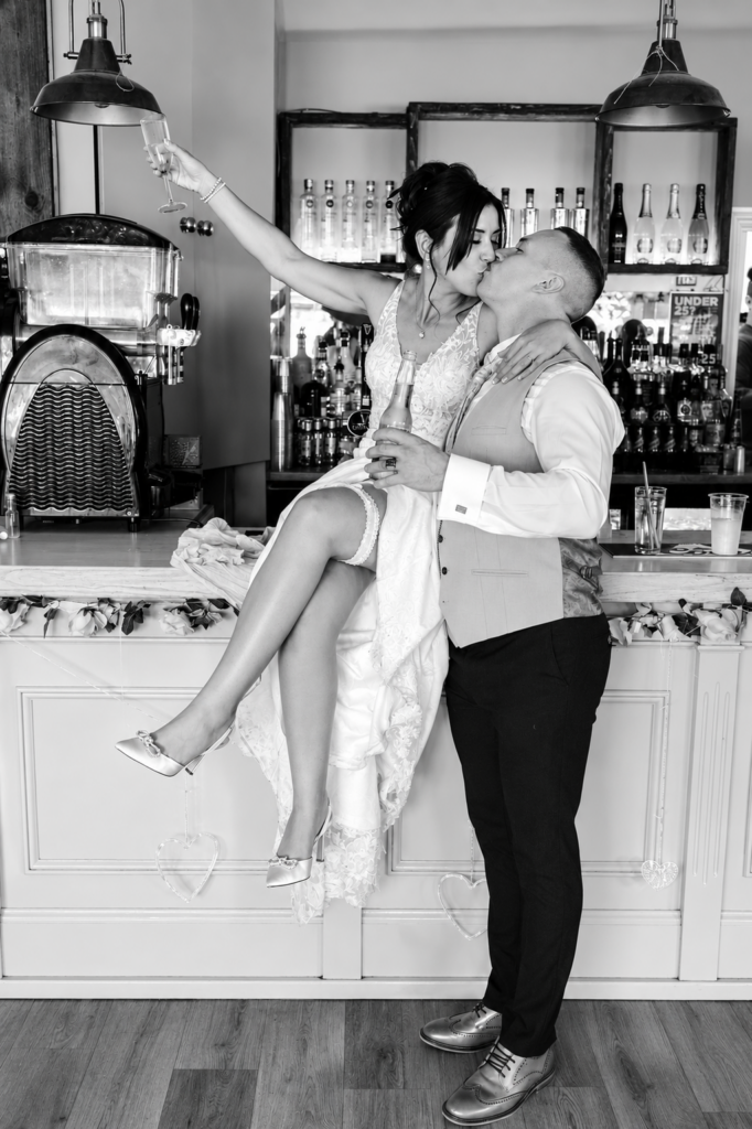 passionate kissing groom & bride
