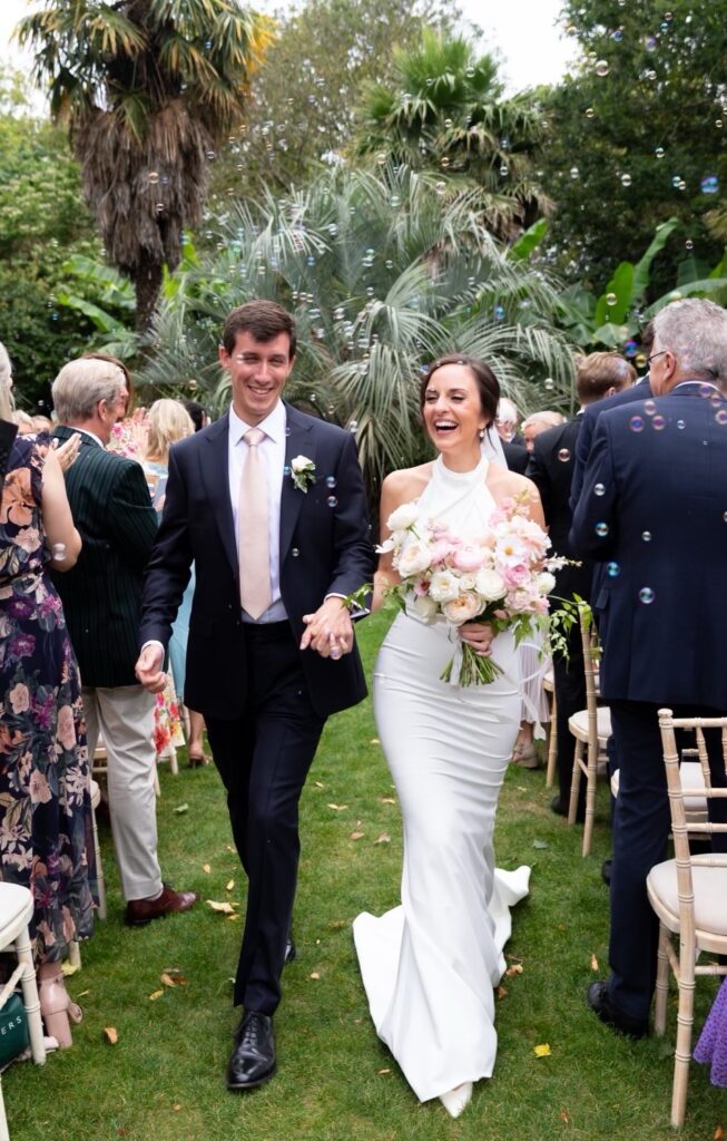 Bride wearing fitted Made With Love wedding dress after bridal alterations