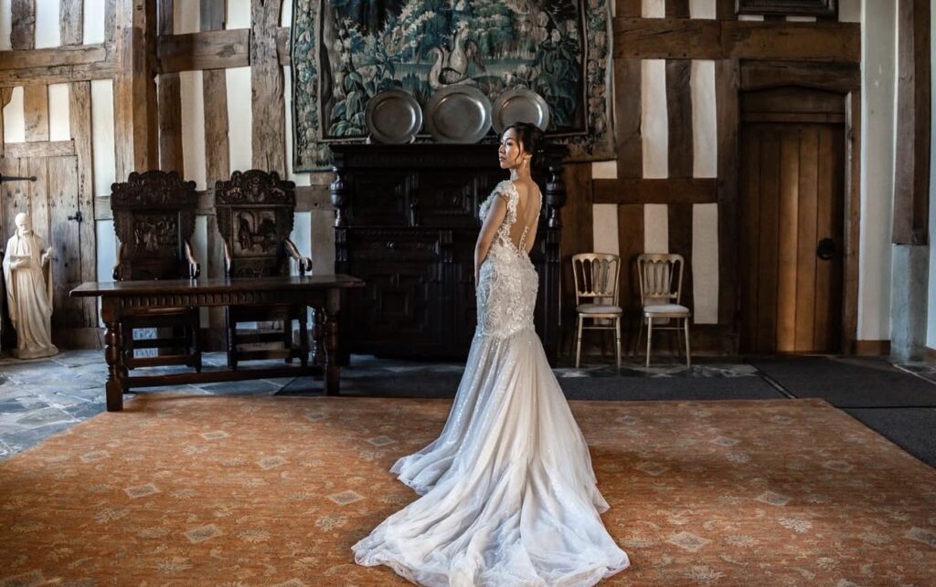 Champagne embroidered Riki Dalal wedding dress after couture bridal alterations and size reduction