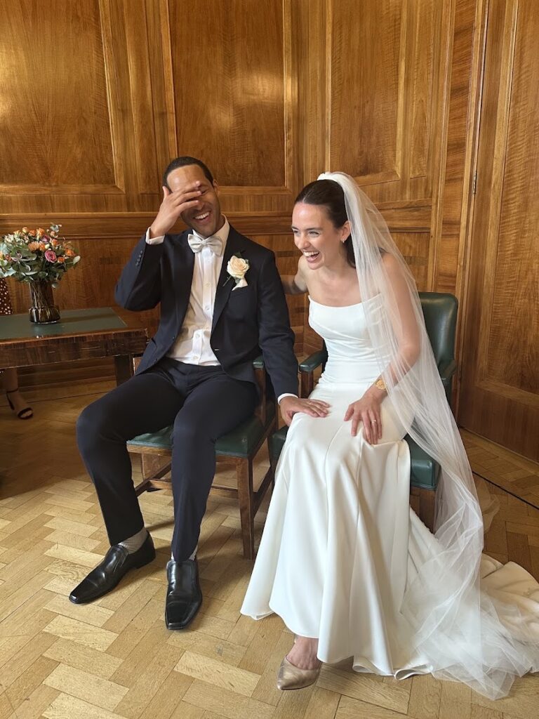 Jessie celebrating outside Hackney Town Hall after bridal alterations