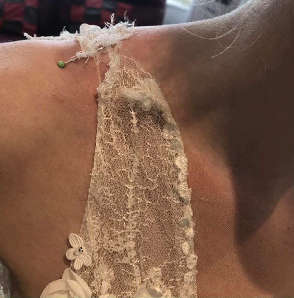 wedding dress shoulder pulling after previous bridal alterations