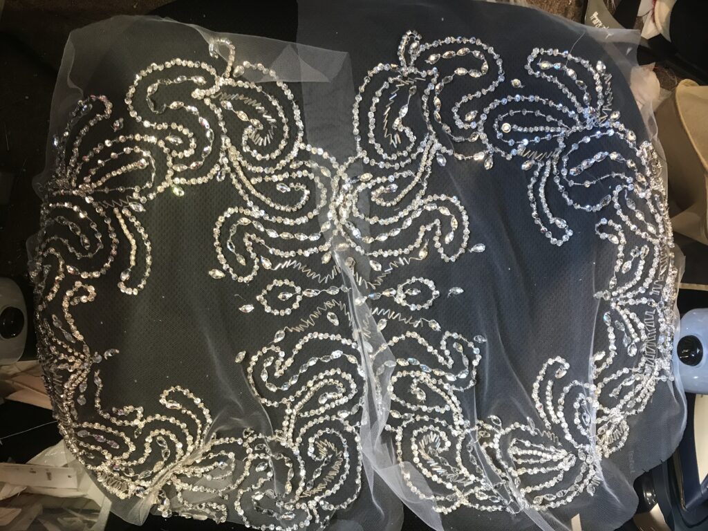 hand embroidery on sleeves to match bodice of crystal embellishment dress