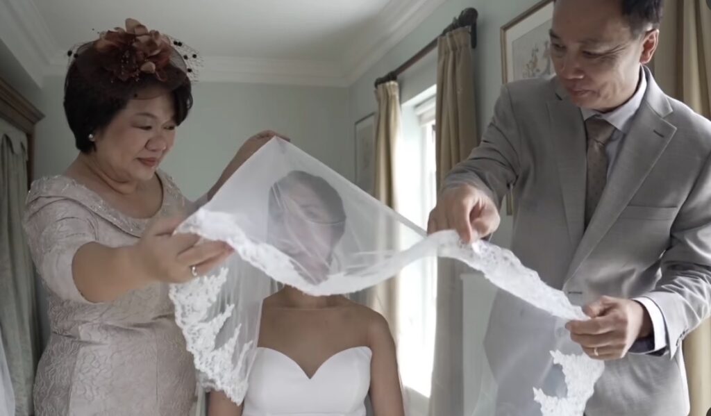 Couture Riki Dalal bridal alterations for a minimalist satin wedding gown with precision body contouring and hem reshaping ceremony picture