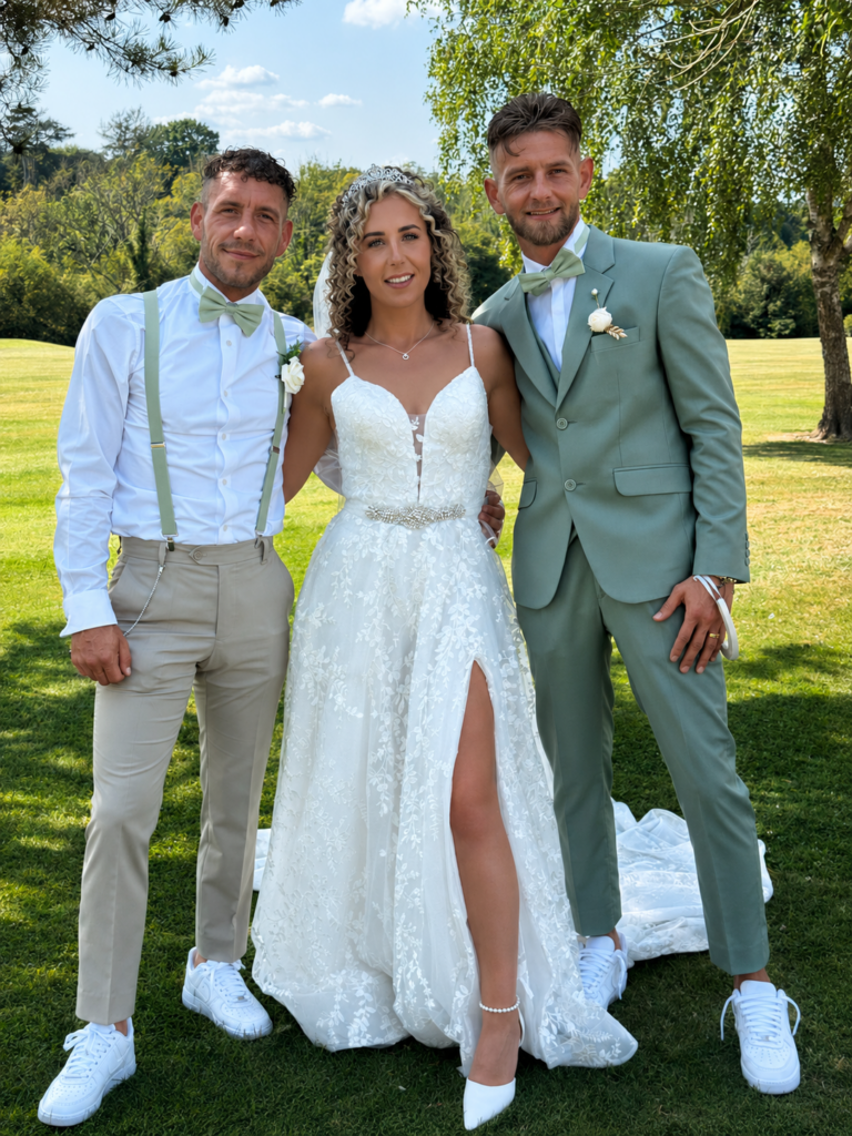 Bride walking in altered WED2B wedding dress with softened silhouette and split