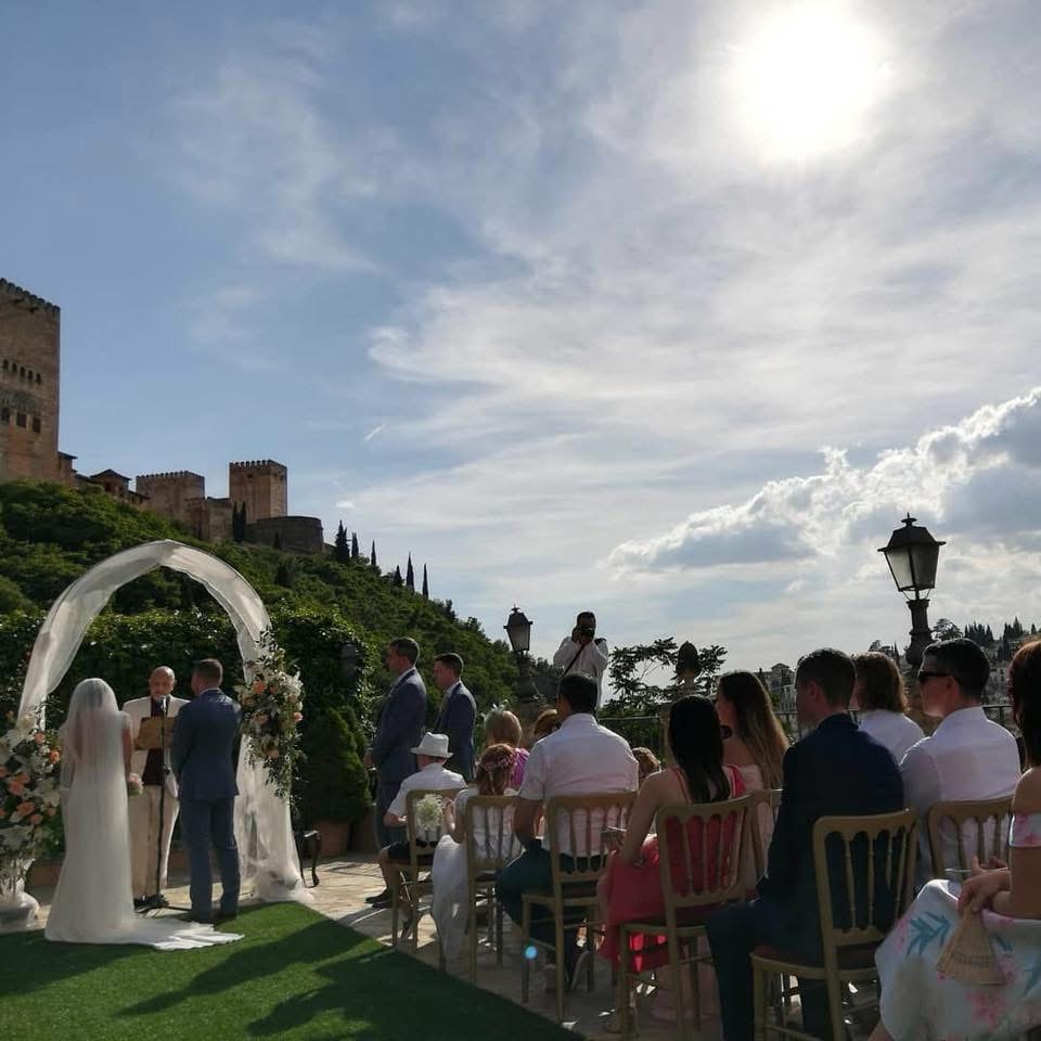 Destination wedding ceremony at the Alhambra featuring Rosa Clará bridal gown