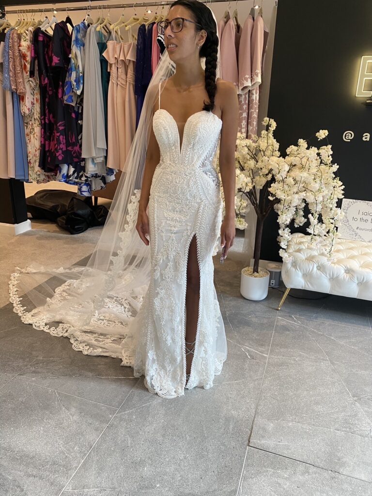 Beaded wedding dress alterations with couture front split and symmetrical lace detailing on wedding day