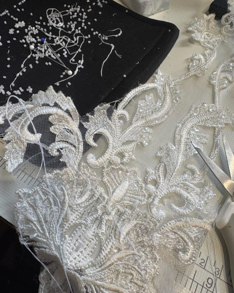  Close up hem view of beadwork Martina Liana wedding dress with heavy beaded in Aurland, Norway