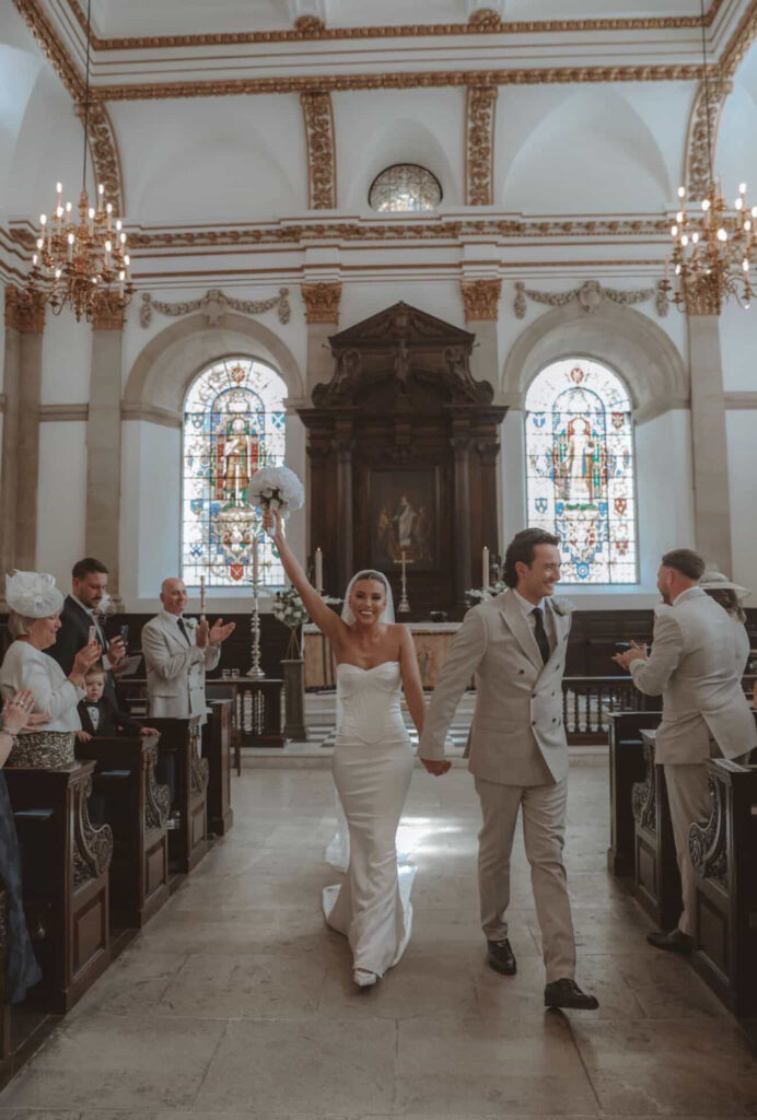 Church ceremony showing wedding dress train after alterations Epsom