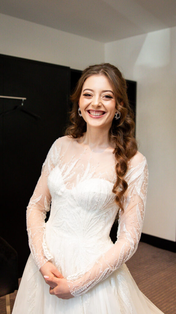 Bridal bodice restructuring with hand repositioned appliqué and beadwork