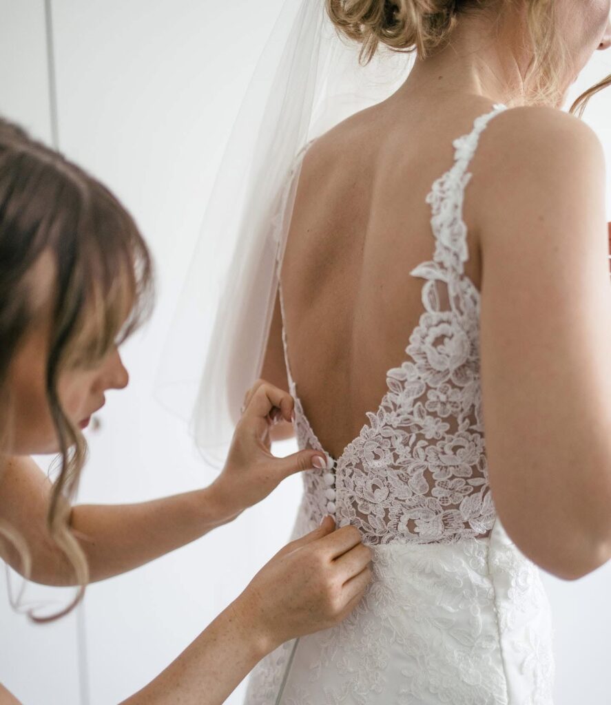 Private bridal fitting with lace wedding dress alterations London