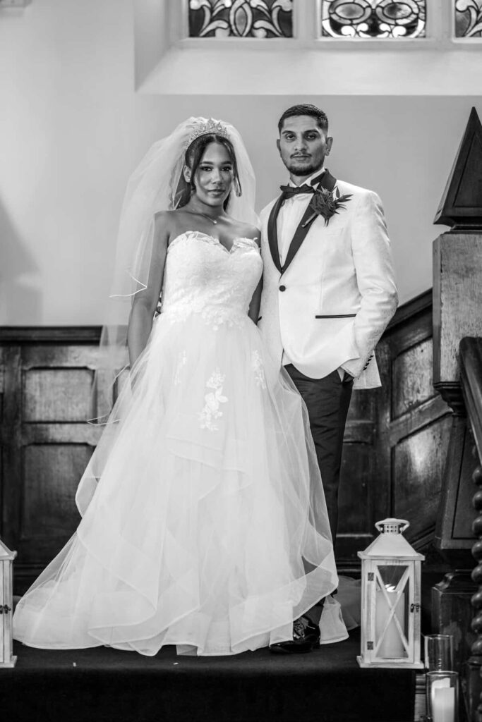 Bride wearing altered WED2B wedding dress alterations purley with couture modesty panel with crin support and reconstructed neckline