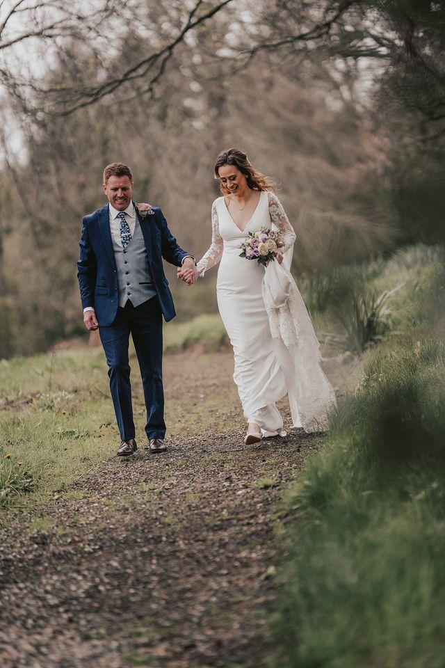 Bride wearing fitted wedding dress after couture bridal alterations