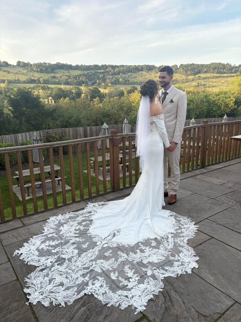 Charlotte in her fitted lace wedding dress following bridal alterations by Zen after recommendation from bridal hair specialist Zoe Stevenson
