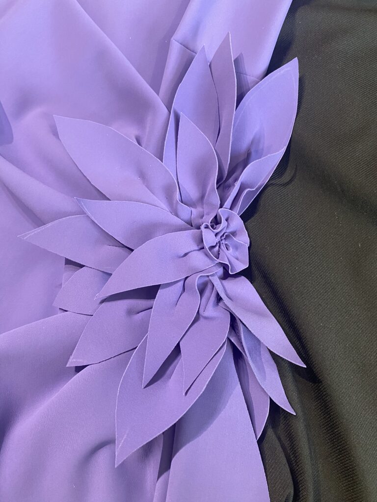 Bespoke floral appliqué positioned onto a Mother of the Groom dress