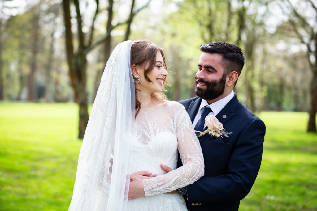 Heavily beaded Eva Lendel wedding dress alterations with embroidered appliqué refinement