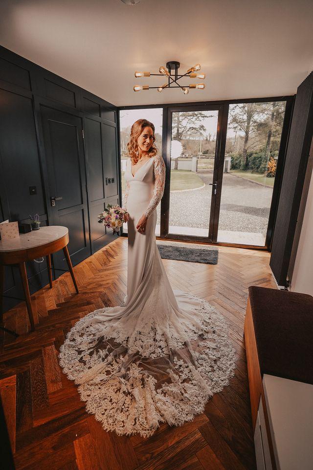 Lace wedding dress refined during specialist fittings