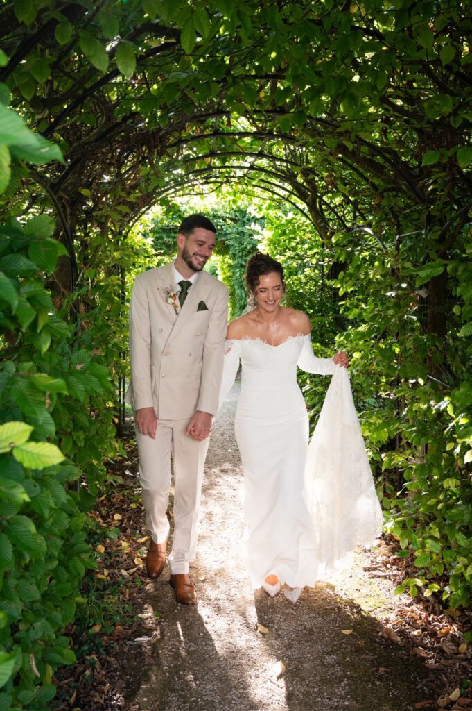 Maggie Sottero bridal alterations London with dramatic cathedral lace train