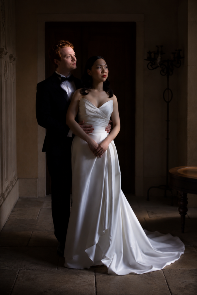 Couture bridal alterations contouring the pleated bodice of a Morilee wedding dress