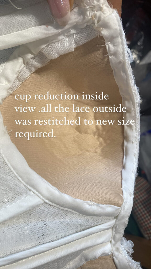 cup reduced to make dress fit like a glove on the bust