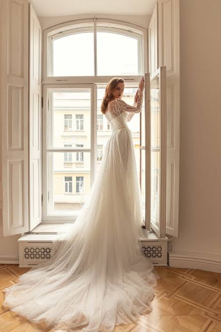 wedding dress before alterations with embroidered appliqué sleeve