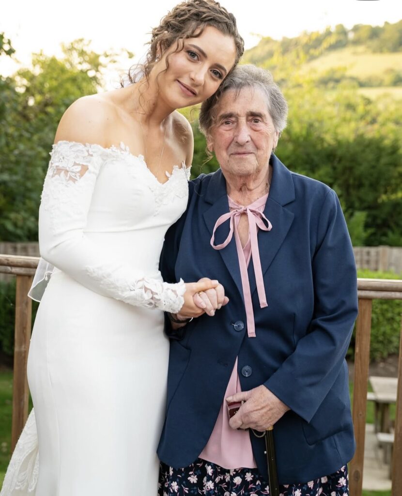 Bride beside grandmother altered Maggie Sottero wedding dress