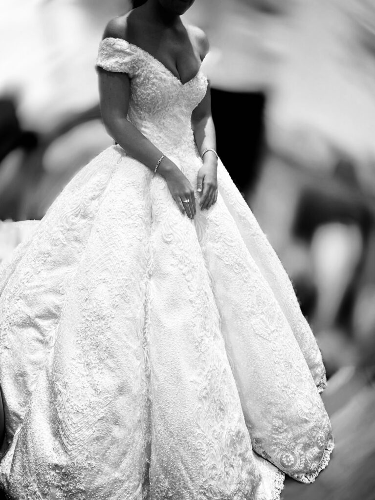 Gypsy wedding dress alterations London featuring a heavily embellished Swarovski crystal ballgown with off-the-shoulder neckline transformation