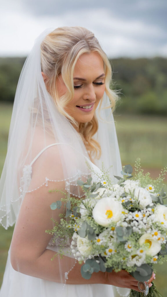 Couture bridal veil and wedding dress fitting details for luxury bridal alterations