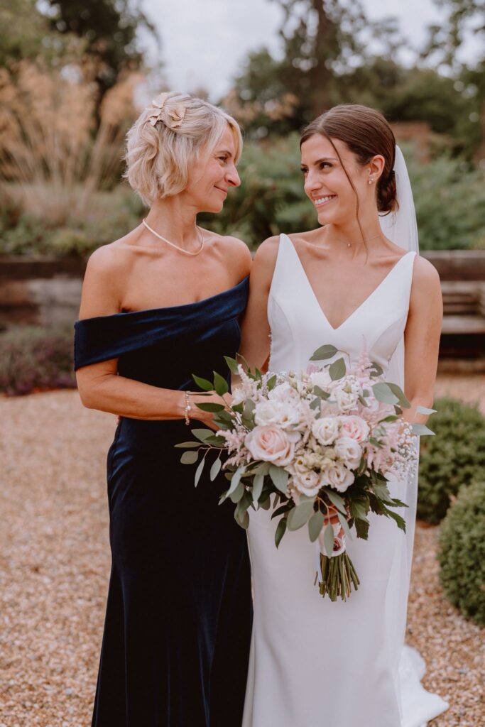 Specialist MWL wedding dress alterations with bust contouring and size reduction mum dress altered as well