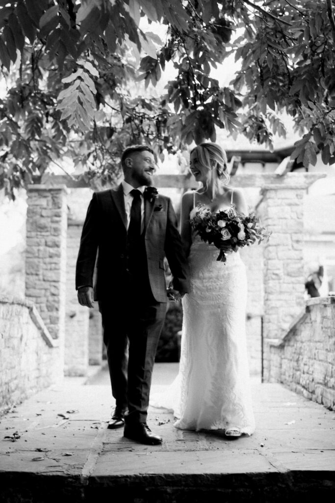 Bride wearing altered Martina Liana wedding dress with dramatic lace train