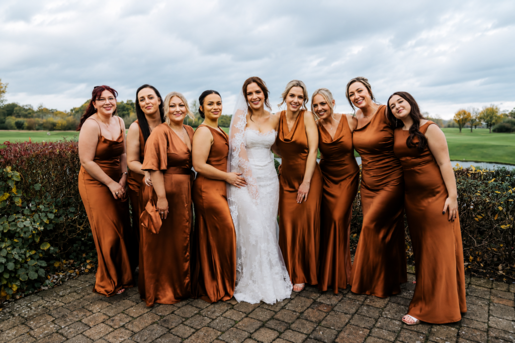 bride with bridesmaids on yhe wedding day all steam pressed and looking picture perfect