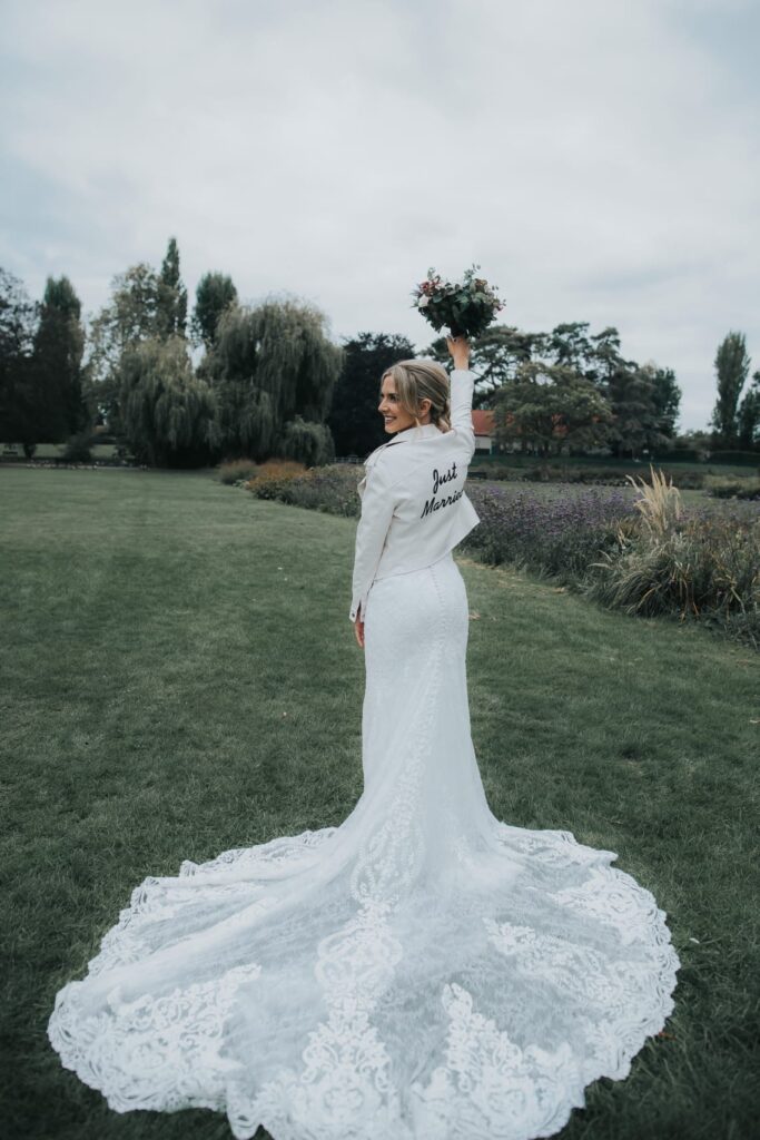 Bride wearing altered Martina Liana wedding dress during a wedding moment