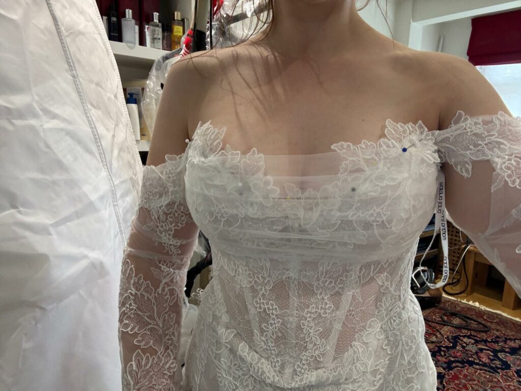 After bridal alterations on Martina Liana lace wedding dress modesty panel on bodice