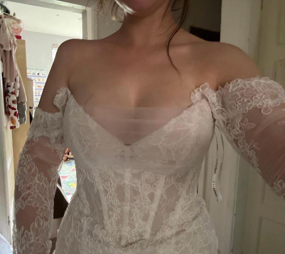 Wedding dress fitting showing couture modesty insert before and neckline reconstruction