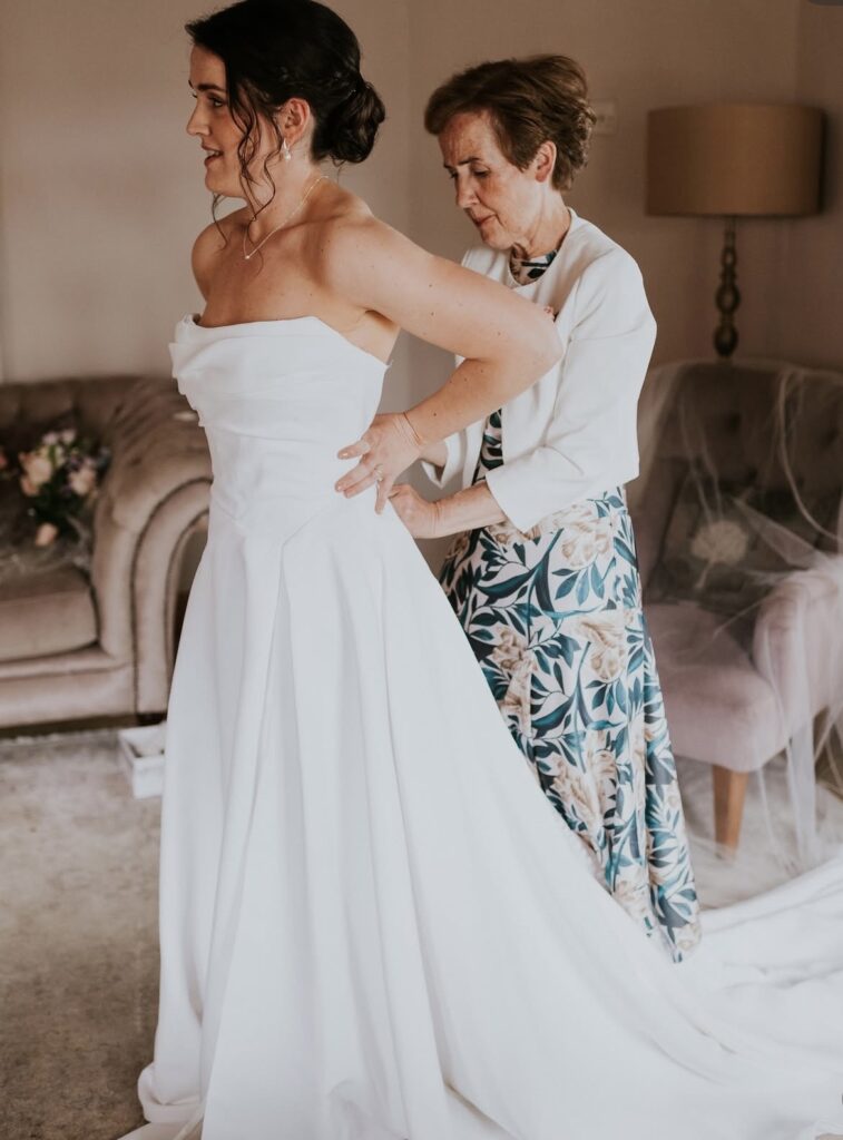 Strapless Mila Nova wedding gown with internal corset and contouring alterations