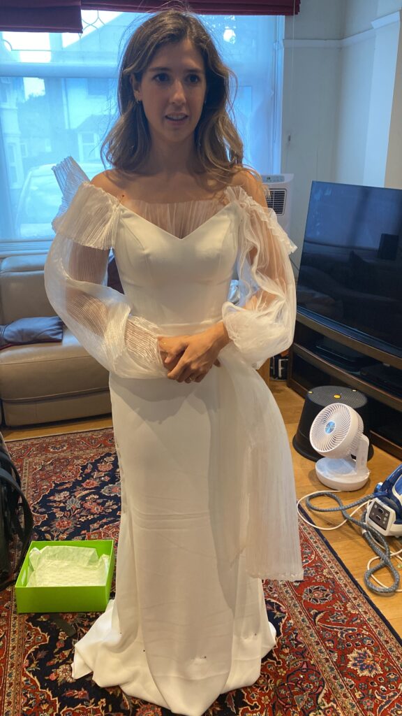 Front fitting during couture bridal sleeve reconstruction using pleated illusion tulle